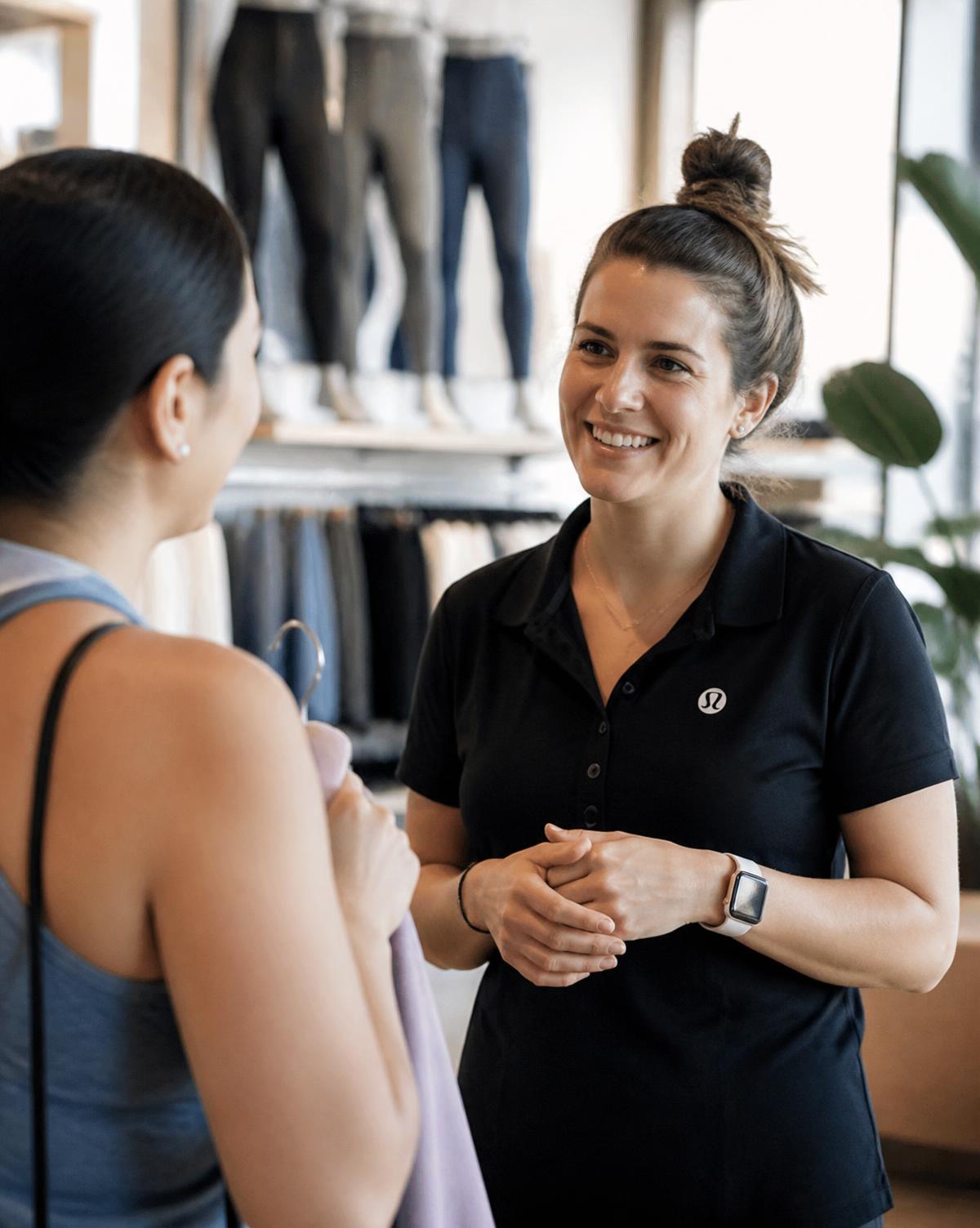 A brand representative in conversation with a customer inside a retail store